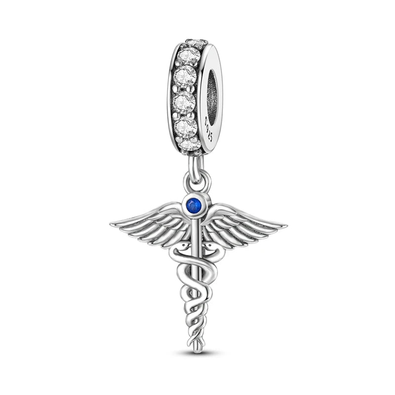 Sterling silver charm beads featuring a winged design and a line of small clear stones.