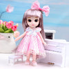 A 17cm articulated princess doll with long purple hair and a pink lace dress sitting in front of a white piano.