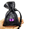 A black PU leather drawstring dice bag with an organizer compartment and a purple gemstone visible inside.