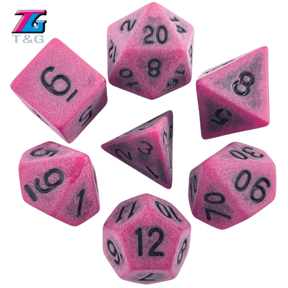 A set of pink polyhedral dice including a d20, d8, d10, and d12.