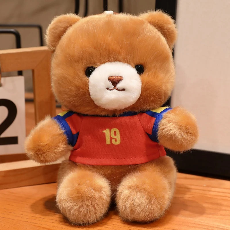 A fluffy brown teddy bear wearing a red and blue football jersey with the number 19.