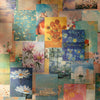 A collage of vintage scrapbook paper featuring floral and nature motifs in various shades of blue, yellow, pink, and green.