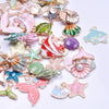Assortment of gold-tone enamel charms featuring sea creatures and starfish for jewelry making