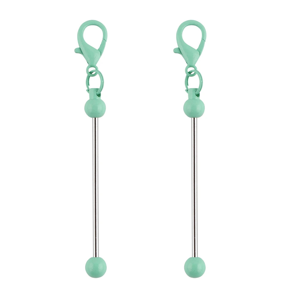 A pair of metal keychain bars with lobster clasps used for DIY jewelry making, colored light green.