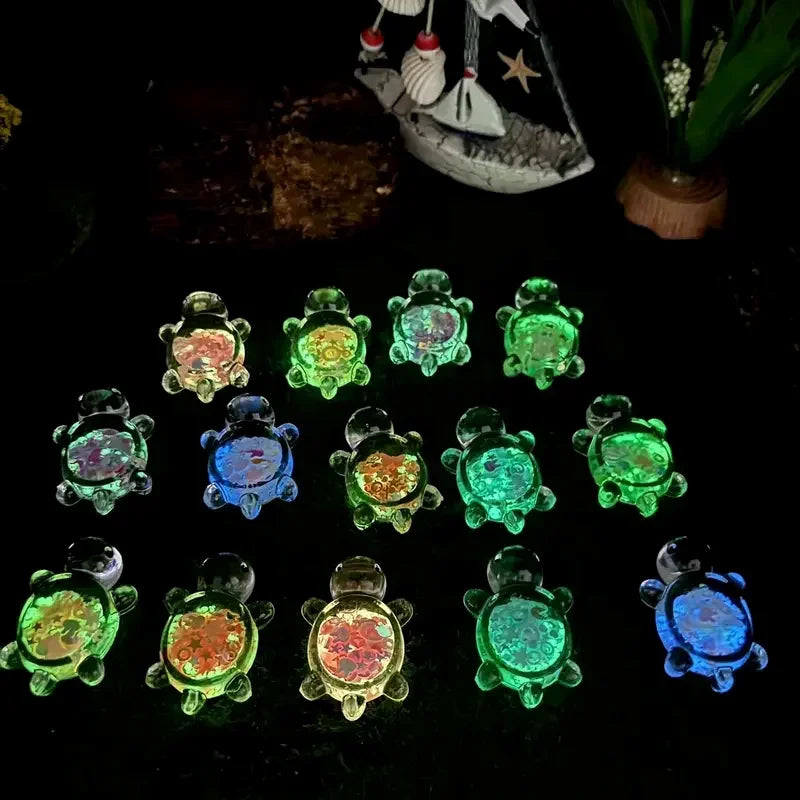 A collection of glow-in-the-dark mini sea turtle figurines in various shades of green, blue, and yellow.
