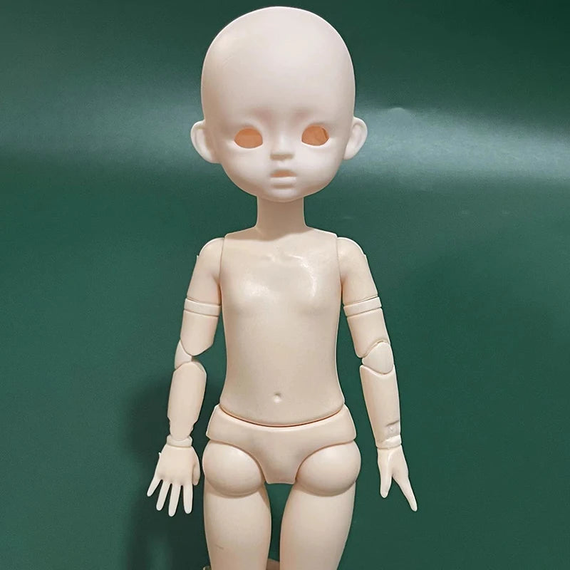 A pale, headless 1/6 scale BJD doll with large orange eyes standing against a dark green background.