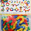 A large set of colorful wooden building blocks shaped like snowflakes, including various geometric and decorative pieces.
