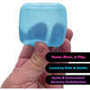 A hand holds a light blue, translucent squishy stress toy cube designed for quiet sensory satisfaction.