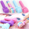 Colorful detachable diamond painting rollers in various shades of purple, pink, and blue shown with a hand.