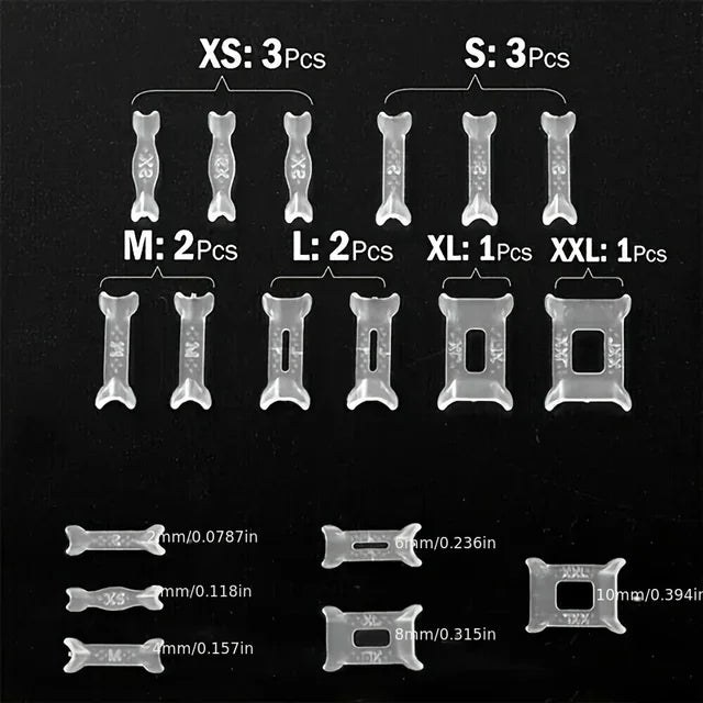 A collection of clear adjustable ring sizer pads in various sizes and thicknesses for jewelry.