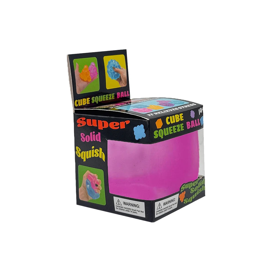 A box of Super Solid Squish Cube squeezable ball toys with colorful cubes and a pink squish ball.