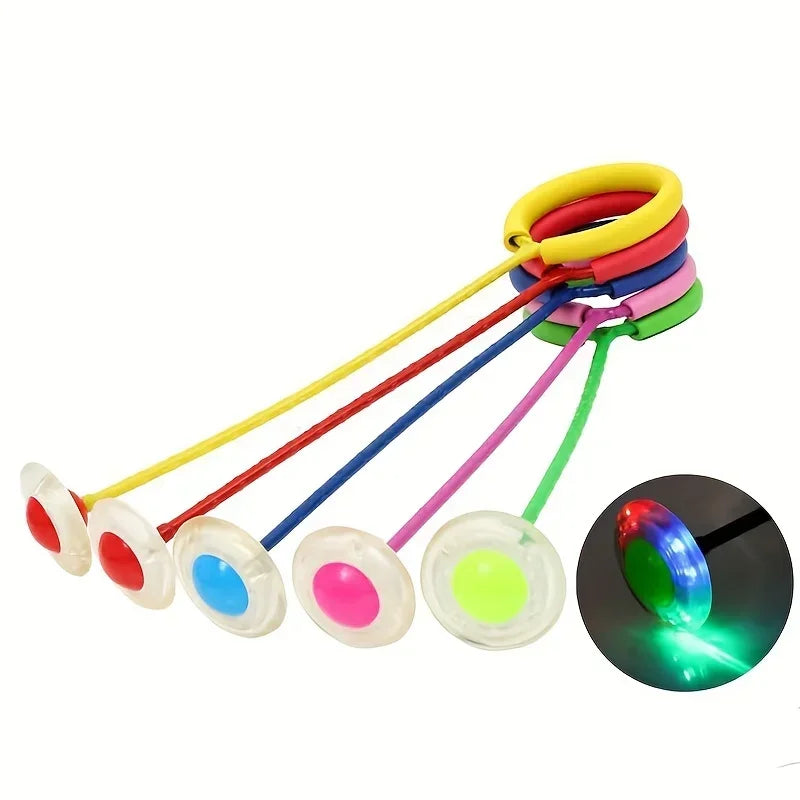 A set of glowing colored skip balls with elastic strings for active play and balance training.
