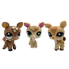 A set of three Bobbing Deer bobblehead toys with light brown fur and green glowing eyes.