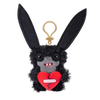A black plush rabbit monster keychain with large eyes and a red heart design.