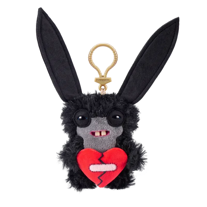 A black plush rabbit monster keychain with large eyes and a red heart design.