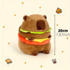 A brown capybara plush toy representing a mother with four baby versions, shown next to a measurement scale.