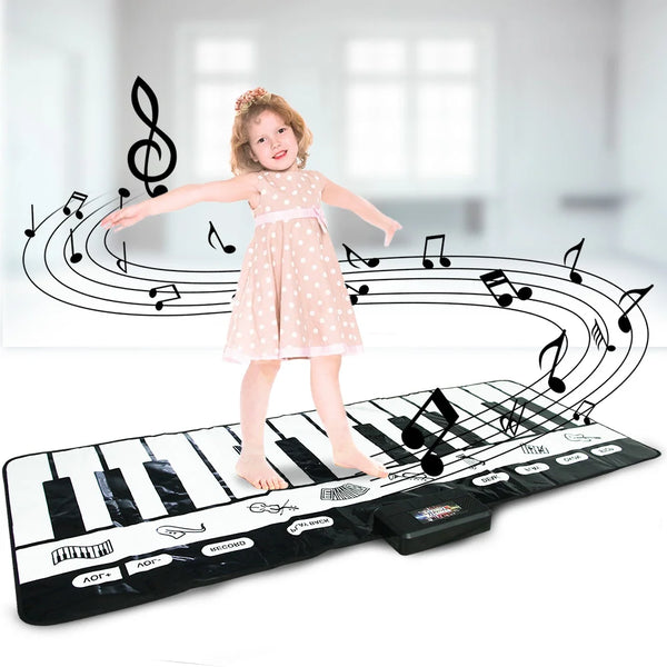 A young girl stands on a musical piano keyboard mat with sheet music and musical notes surrounding her.