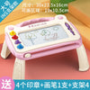 A pink magnetic drawing board for kids featuring a grid surface and various colored tools for drawing and erasing.