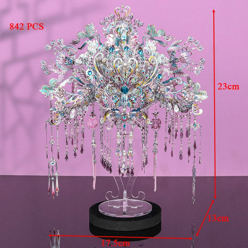 A detailed model kit of a phoenix coronet made from silver-colored metal pieces, displayed on a stand.