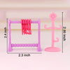 A pink pet spa bath and drying rack playset featuring a purple frame and pink silicone toys.