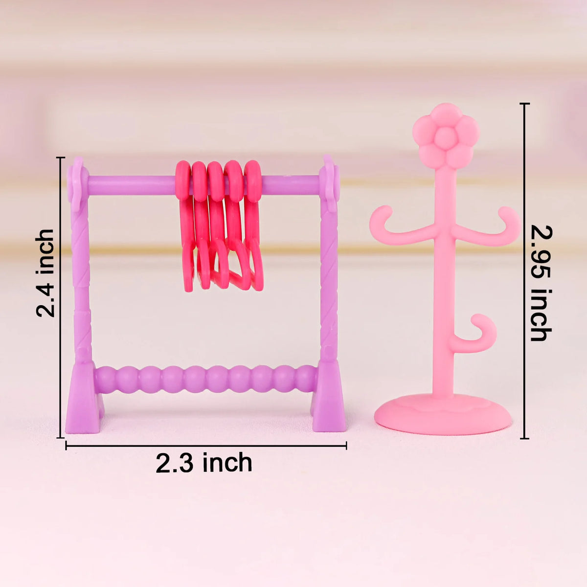 A pink pet spa bath and drying rack playset featuring a purple frame and pink silicone toys.