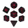 A set of black silicone polyhedral dice, including a d12, d20, and d30, displayed against a white background.