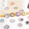A collection of heart-shaped crystal stickers featuring cute cat and puppy designs on a beige background.