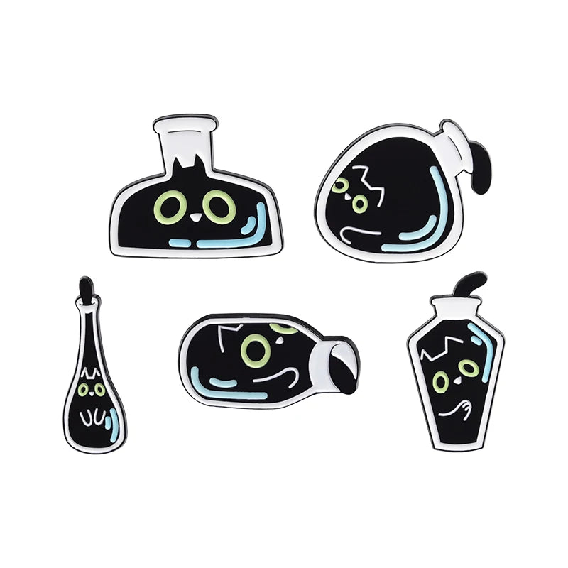 A set of four black cat enamel pins featuring stylized cats with glowing blue eyes.