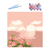 Paint by numbers kit featuring a sunset landscape with pink and green flowers on a canvas.