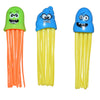 A set of three plastic dive toys featuring a green, blue, and yellow squid-like creature.