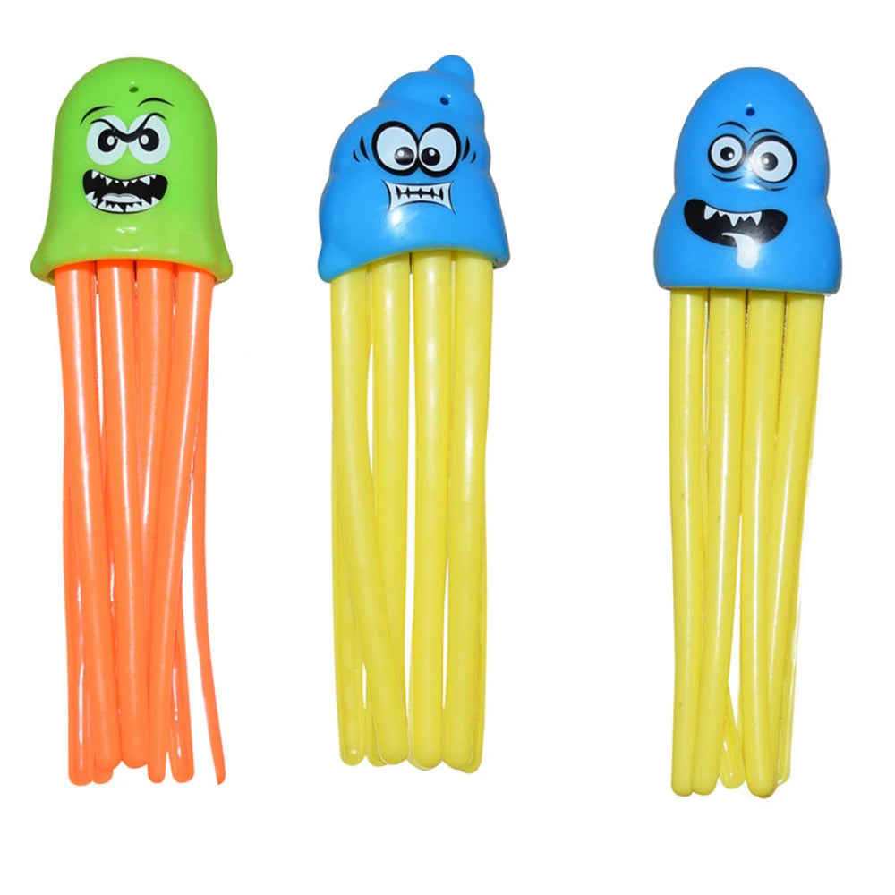 A set of three plastic dive toys featuring a green, blue, and yellow squid-like creature.