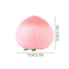 A pink peach-shaped squishy stress relief toy with dimensions of 7cm by 7cm and a thickness of 2.7 inches.
