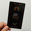 A black oracle card featuring a crescent moon and foliage, with the text Magical potential is forecast in the witch's head.