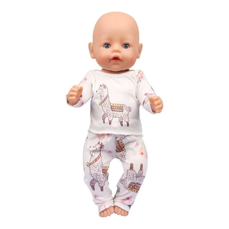 A baby doll wearing a white unicorn pajama set with pink floral patterns.