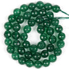 A strand of polished, deep green natural sea sediment jasper and turquoise beads for jewelry making