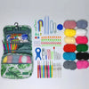 A complete crochet kit with yarn, hooks, and accessories laid out on a white background.