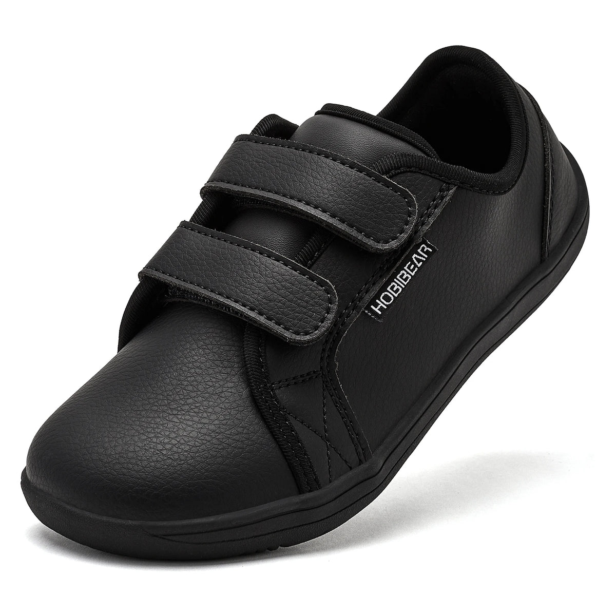 Black kids barefoot sneakers with double hook-and-loop straps shown from the side.