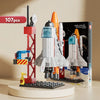 A 107-piece space rocket building blocks set featuring a launch center and rockets displayed next to its box.