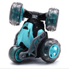 A black and teal stunt car with five wheels is shown from the side.