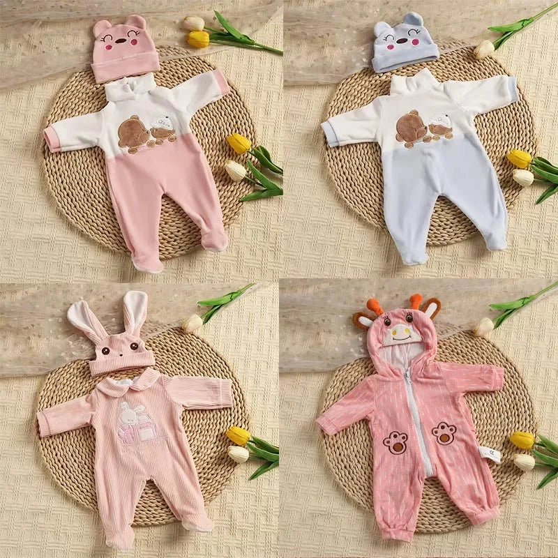 A set of pink and white animal romper outfits for baby dolls, including a long-sleeved top and pants.