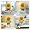 Handmade crochet sunflower pot doll in yellow and green on a desk and home decor