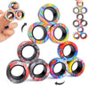 A set of magnetic fidget spinning rings in various colors and patterns, shown being held by a hand.