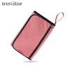 A pink portable 2-in-1 baby changing mat with a storage bag and drawstring.