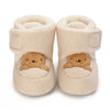 Pair of beige baby winter cartoon boots with soft lining and non-slip soles