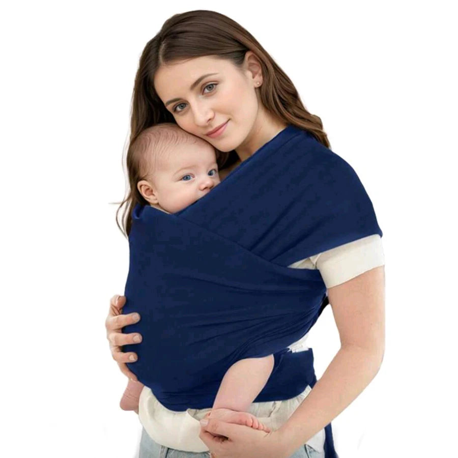A woman wearing a navy blue knitted fabric multi-functional baby carrier while holding a baby.