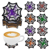 A set of DIY diamond art coasters featuring spider web designs in purple, orange, and green on a black holder.