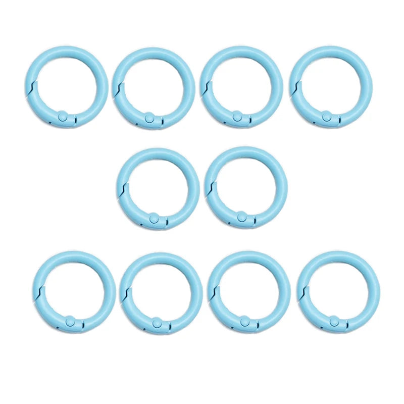A set of eight light blue alloy snap hook keychain clips arranged in two rows.