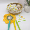 A set of ergonomic crochet hooks, stitch markers, and needles in various colors resting on a woven basket.