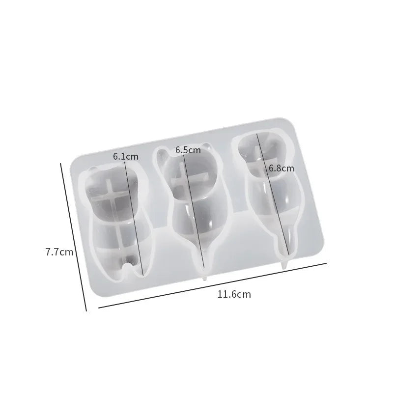 A silicone mold tray with six cavities for making cat resin items like keychains, pendants, and pen holders.