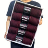 A package of five skeins of dark burgundy alpaca wool yarn for knitting and crochet projects.